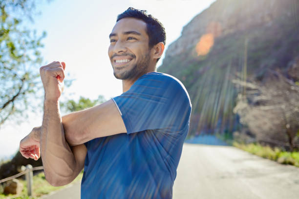 low testosterone and joint pain — man stretching before a workout to protect achy joints